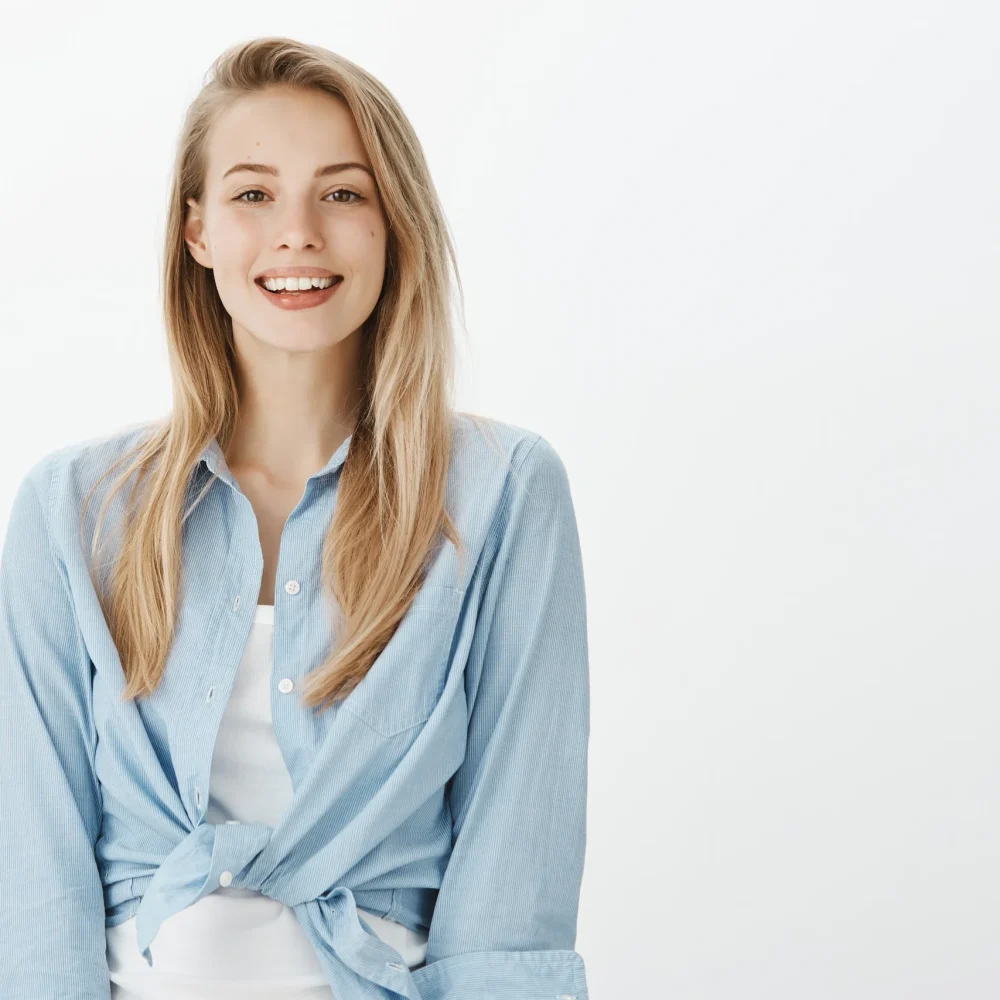 TourDent happy female patient with perfect white smile after dental treatment abroad